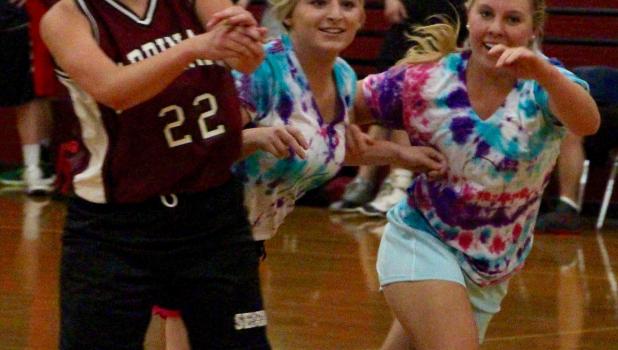 Fun moments on the court again From left, Jasmine McGillivray, Mikayla Wing and Emily Israelson share smiles after a scramble for the ball in the Cardinal Alumni Basketball Tournament. (Staples World photo by Mark Anderson)