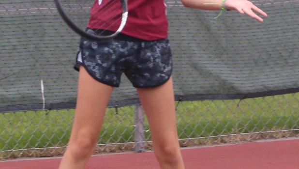 Tennis action Brynn Williams zeros in on a forehand.