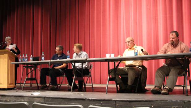 School board candidate forum Staples-Motley School Board Candidate Forum moderator Brenda Halvorson, left, reads an audience question as the candidates wait to answer them. From left, Creig Dobson, Chad Longbella, Greg Frisk and Bryan Winkels. (Staples World photo by Mark Anderson)