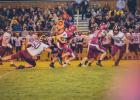 Isaiah Schultz takes off on a scramble behind the blocking from Dominic Gomez (60). (Photo by Jeremy Moulton)