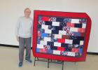 U.S. Air Force Veteran Al Evans of Motley stands beside the ‘Quilt of Honor’ that was recently bestowed upon him in recognition and gratitude for his military service and sacrifices made. The quilt was made by members of a Quilt of Honor chapter in Little Falls. (Staples World photo by Dawn Timbs)