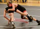 Aiden Winter earns a takedown in a closely contested match against Frazee. (Staples World photo by Mark Anderson)
