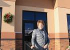 Mary Kobliska in front of the building she has worked in for 42 years. (Staples World photo by Mark Anderson)