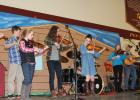 While the judges were tallying their scores, contestants at last year’s Fiddler’s Contest in Pillager combined their talents, playing a few familiar tunes for the audience including “Cripple Creek” and “Amazing Grace.” Pictured above, from left, are fiddlers Sam Smith, Fargo, N.D.; Abigail Carey, Farmington; Sara Smith, Fargo; Shelby Huston, Minot, N.D.; Maria Mathison, Foreston; and Kevin Huston (Shelby Huston’s father), providing guitar accompaniment. This year’s fiddler’s contest will be held Saturday, A