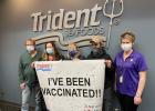 From left, Jim Hobson, Kathy Petrich, Fawn Castle, and Rodney Haidle, Trident Seafoods employees, celebrate local vaccinations with Melissa Harris from Morrison County Public Health. (Submitted photo)