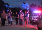 Police wives and United For Blue Candlelight Vigil organizers Tina Maros and Jackie Goff bring balloons  for the “balloon release” that was held after the ‘moment of silence’ during the candlelight vigil. Alisha Winter was also one of the organizers. “It was a great community response for the first year,” said Maros. “It’s something the wives and I talked about doing every year. Some of the people in the community asked what they can do to help next year, so we I would say the community response was awesome