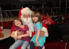 he Staples Host Lions are offering their free community meal  Dec. 10 at the Staples-Motley High School cafeteria. Last year Santa Claus came to visit and spoke with Melissa Anderson and Elizabeth Tangeman. This year he is bringing Mrs. Santa along. (Staples World file photo)