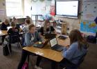 Staples-Motley fifth grade students study in one of the new rooms refurbished to move the middle school to the high school building. The room is equipped with smartboard technology that students can work collaboratively with their computers. Sitting at the front table are Chelsie Kampa, Annie Schlosser and Sadye Anderson, at the back table are Emmit Djuren, Emersen Bettis, Chloe Trantina and Paige Warren. (Staples World photo by Mark Anderson)