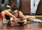 Blake Neelan turns his opponent upside down in the Section 7A semifinals, turning a deficit into a pin. (Staples World photos by Mark Anderson)