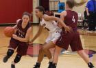 Elizabeth Danilyuk dribbles past the defense as Alix Peterson sets a pick. (Staples World photo by Mark Anderson)