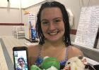 Sophomores Adriana Dickey and Evelyn Gonzalez (on phone screen) will be the captains of the Cardinals swim team this season.