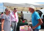 Bobbe and Brad Anderson of Staples chatted with Perry Cuperus (far right) at the Staples Area Farmer’s Market Aug. 9. Cuperus, of Sebeka, sells farm fresh eggs at the market. 