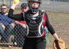 Riley Peterson throws a runner out.