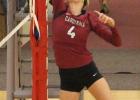 Camryn Banaka tips a ball over the net.