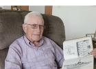 Robert Cole still has a book from his tour with the USS Steven Potter, with a photo of the destroyer and memories of the many places he went in four years with the U.S. Navy. (Staples World photo by Mark Anderson)