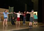 Rehearsals underway at Centennial Cast members in the upcoming Lamplighter Community Theatre production, “The Wizard of Oz,” worked on staging a song with choreographer Brian Sterriker (in front) during a recent rehearsal. Back row, from left, are Macy Judd, playing Dorothy; Brynn Bestland, Toto; Jacob Denning, Scarecrow; Marly Simmons, The Tinman; and Rob Freelove, The Cowardly Lion. The musical will be performed at Centennial Auditorium in Staples Thursday - Saturday, July 11, 12, 13 at 7 p.m.; and Sunday, July 14, 2 p.m. (Staples World p