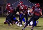 Isaac Swensrud (58) and Trey Skeesick (83) open up a big hole for Eric Lisson to run through. Lisson ran for 201 yards and scored four touchdowns in the Homecoming game against Long Prairie-Grey Eagle. (Staples World photo by Mark Anderson)
