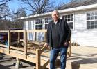 Lynn Peterson, new manager at The Vintage Golf Course, in front of the deck being built at The Vintage. (Staples World photo by Mark Anderson)