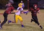 Mason Nyhus provides the block and Josh Lombard turns the corner for a big gain late in the game against Wadena-Deer Creek. (Staples World photo by Mark Anderson)