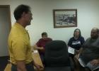 Phil Martin (left) from Bolton & Menk, Inc., listened to feedback from the public following a public hearing at Motley City Hall July 18, to discuss a proposed streets project. Seated, from left, are Bruce Brotherton, public works supervisor; Holly Cuffe and Joe Anziano, both of Motley. 