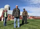 Bob Helle, center, stood just above the site where a 1-million-gallon manure pit once served a 50-cow dairy. Helle worked with the Todd SWCD to voluntarily close the pit in 2020, with support from an EPA grant and SWCD local capacity dollars (Clean Water Funds from BWSR). Todd SWCD Manager Deja Anton and Bob’s son Mike talked about the project on Sept. 30, 2020, on Helle’s farm north of Clarissa. The Helles went on to install a livestock river crossing and access control, which was completed in 2024. (Photo