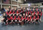 The Staples-Motley youth wrestling team with their fifth place trophy at the NYWA tournament. Front row from left, Tim Lind, Jonah Becker, Ace de Coup-Crank, Ryker Pesta, Bennett Sonenstahl, Cora Tappe, Cygnus Walz, Brantley Bendson, Reed Leach and Maxx Carlson; row two, Camrik Tappe, Jacob Reeck, Liam Jennissen, Jacob Odden, Cooper Tappe, Tristan Moore, Tayden Weite, Jayden Rogers, Garrett Bjerga, Gavin Caldwell and Elliott DiGiovanni; back row, Coaches Chris Dobson and Dan Bjerga. (Submitted photo)