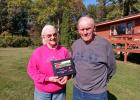 Ken and Hope Johnson of the Leader/Poplar area were named the Cass County Farm Family of the Year by the University of Minnesota for 2020. They are pictured at their farm with the award they received last spring. Due to COVID-19, they were unable to accept the award in person. (Staples World photo by Dawn Timbs)