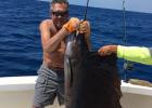 Tom Danculovich of Staples caught this seven-foot swordfish while on vacation recently in Cancun, Mexico. “He’s out there swimming,” Danculovich said of the giant fish, which he opted to throw back in the water rather than having it mounted and shipped back home. (Submitted photo) 